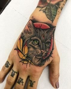 Traditional Cat Hand Tattoo