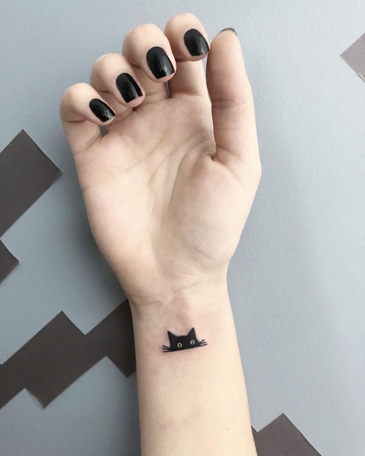 Small Cat Wrist Tattoo