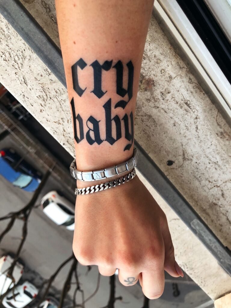 Word Crybaby Wrist Tattoo