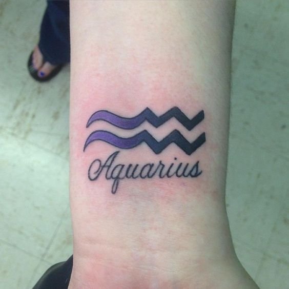 Aquarius Script Wrist Tattoo