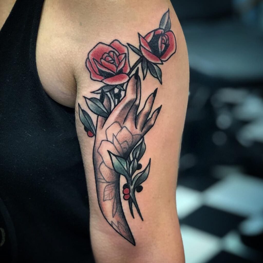 hand holding  tattoo