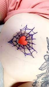 spiderweb nipple tattoo