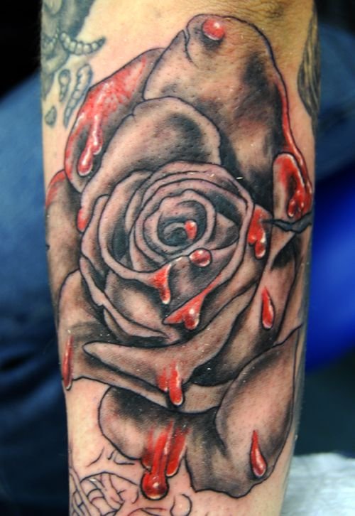 black bleeding rose tattoo