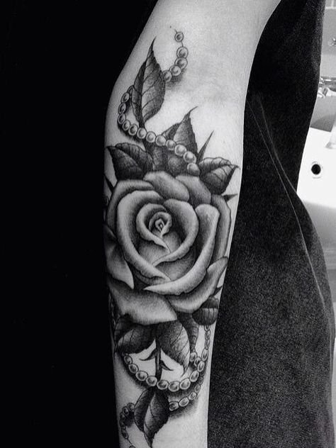 black and white forearm tattoo