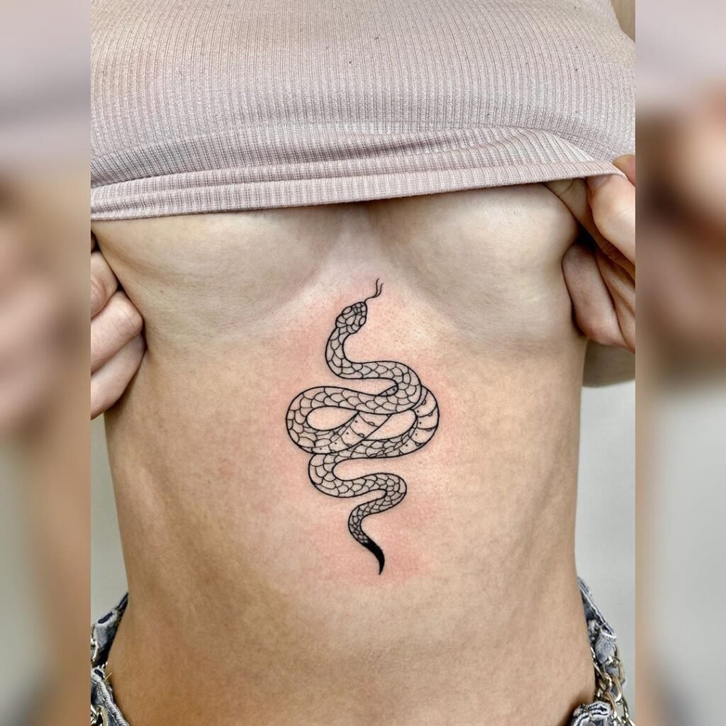 snake underboob tattoo