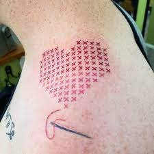 stitched heart tattoo