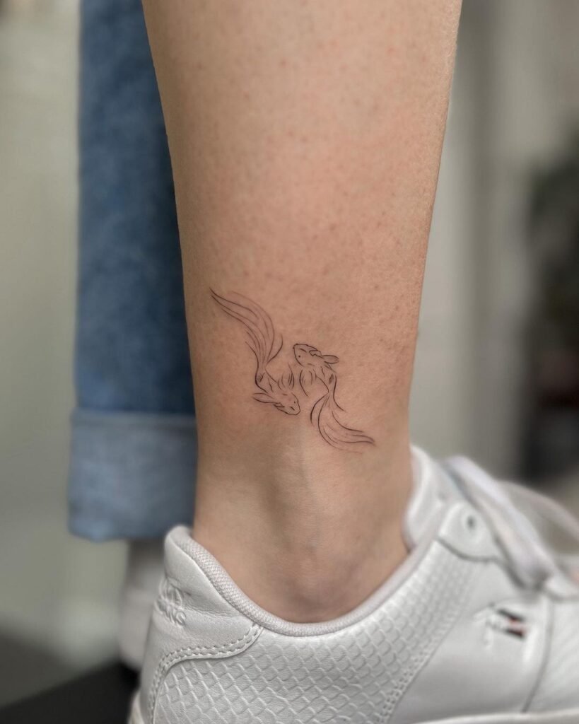 feminine small fish tattoo