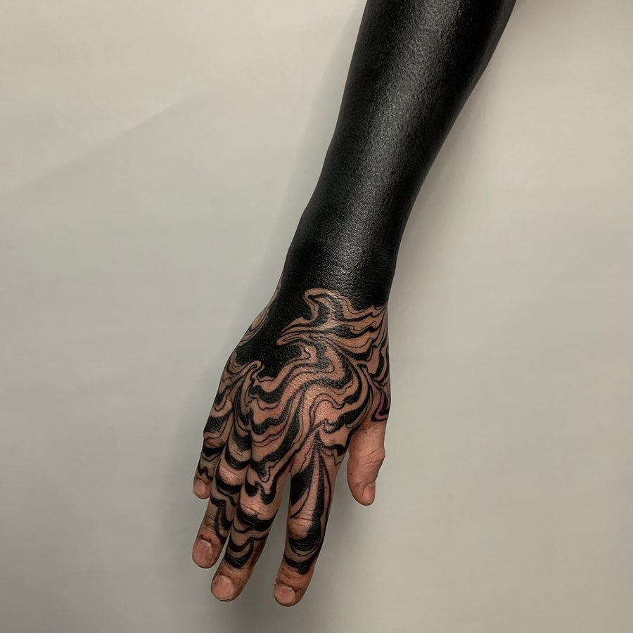 hand blackout tattoo
